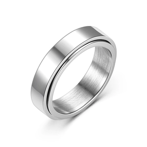 Minimalist silver spinner ring with polished exterior and brushed interior texture on white background