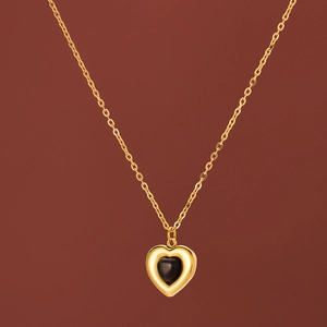 Golden heart pendant necklace with black cat-eye stone on minimalist O-chain