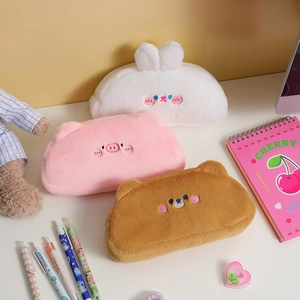 Three plush cartoon animal pencil cases including pig, bunny, and bear in soft material