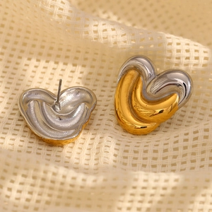 Fashionable two-tone 18K gold plated heart stud earrings with a twisted metal design