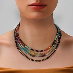 Detail of multi-layer colorful beaded necklace with turquoise and lapis stones on neck