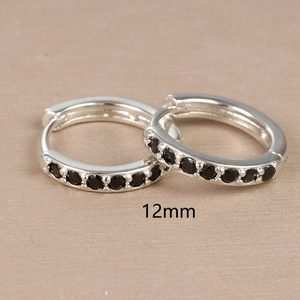 Close-up of 12mm 925 sterling silver hoop earrings with black zircon stone inlay