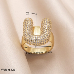 Detailed view of gold 'U' ring with zircons showing 18mm inner diameter and 12g weight