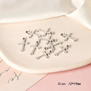 Detailed view of silver cross charms for DIY jewelry making, size 12x19mm set of ten