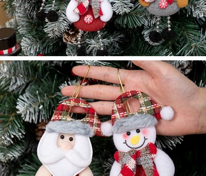 Detail of handmade Christmas fabric ornaments showing Santa and Snowman textures