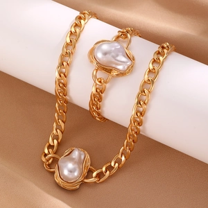 Baroque pearl jewelry set with gold Cuban chain necklace and bracelet on silk