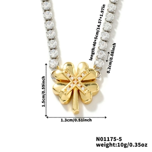 Macro shot of gold clover pendant with cubic zirconia chain and product dimensions