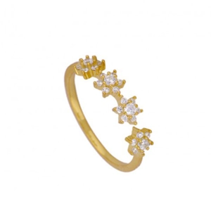 Macro shot of gold-plated silver ring featuring four continuous sparkling zircon flowers
