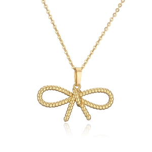 Elegant gold bow knot necklace with twisted rope texture on a reflective white background