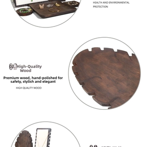 Detail of handcrafted dark wood jewelry display trays and stands with natural texture
