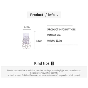 Set of minimalist geometric hoop earrings in various sizes on white display card