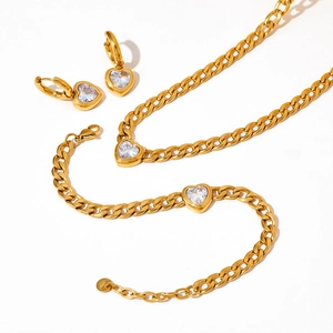 Gold stainless steel jewelry set featuring heart zircon pendants and cuban chain links