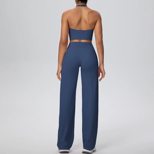Rear view of dark blue halter yoga top and wide-leg trousers on fitness model