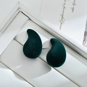 Dark green flocked teardrop stud earrings with silver pins in a white jewelry box