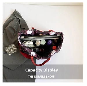 Spacious tote bag with dark skull print showing large capacity for laptop and daily items