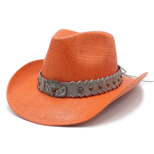 Detailed close-up of orange straw cowboy hat with studded band and bull head buckle