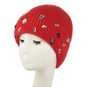 Women's red knit beanie with sparkling rhinestones for winter warmth and fashion