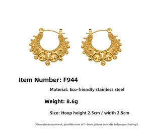 Detail view of retro gold hollow earrings made of stainless steel showing size and weight