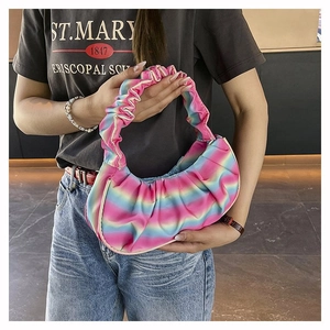 Detail of rainbow pleated dumpling shoulder bag with soft gradient pastel colors