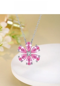 Macro shot of S925 sterling silver flower necklace with pink pear-cut stones and diamonds
