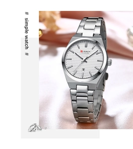 Silver stainless steel women's watch with date display on pink silk background