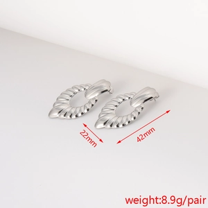 Detailed view of silver textured earrings with size measurements 42mm and 22mm