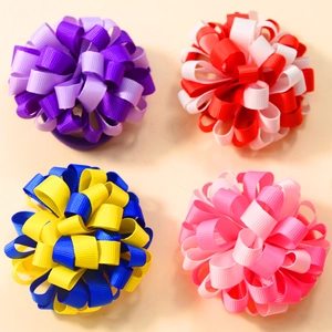 Detailed top view of handmade ribbed ribbon hair accessories in vibrant mixed colors