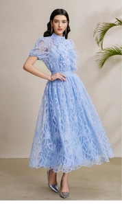 Close-up of light blue lace texture and ruffle collar on a bubble sleeve dress