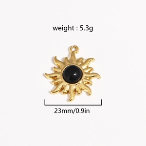 Detailed view of gold sun pendant with black stone and size dimensions 23mm
