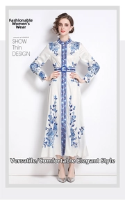 Detail of white maxi dress with blue floral print, mandarin collar and buttoned front