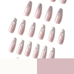 Christmas coffin nails with nude pink base, silver glitter gradient, and white snowflakes