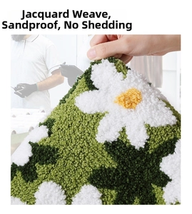 Detail of 3D green floral bath mat showing thick jacquard pile and non-shedding texture