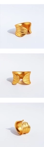 Detailed views of wide gold leaf textured open ring with matte brushed sculptural finish