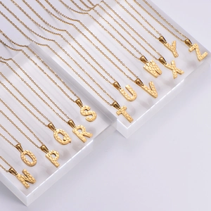 18K gold plated stainless steel initial necklace featuring a unique hammered stone texture