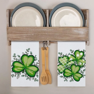 Detail of St. Patrick's Day microfiber kitchen towels with green shamrock patterns