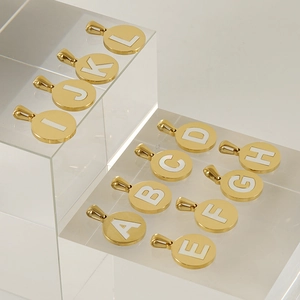 Golden stainless steel necklace with 18K gold-plated initial pendants and shell inlay