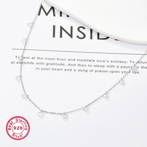 Detailed macro view of S925 sterling silver chain necklace with sparkling zircon beads
