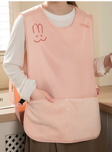 Detail of pink waterproof apron with plush absorbent pockets and cute rabbit design