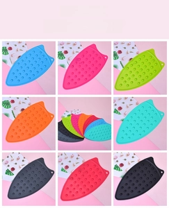 Detailed view of heat-resistant silicone iron rest pads in multiple vibrant colors