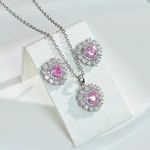 Pink heart-shaped ruby necklace and earring set with micro-pave cubic zirconia diamonds