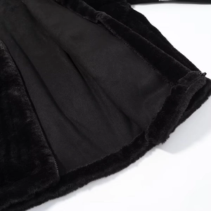 Detail shot of black plush fabric texture and soft fabric lining with matching zipper
