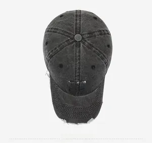 Top view of black vintage baseball cap with embroidered N logo and frayed edge detail