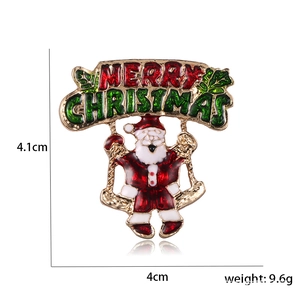 Detailed view of Santa Claus brooch with Merry Christmas banner and product dimensions