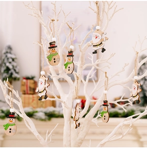 Detail of wooden Christmas tree ornaments featuring Santa and snowman with rustic rope loops