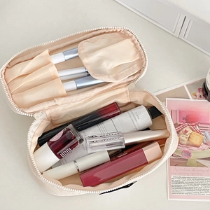 Large capacity pastel pink makeup travel bag with interior compartments for cosmetics