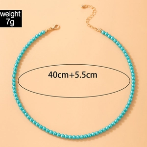 Detail view of blue beaded necklace with gold lobster clasp, 40cm plus 5.5cm extension