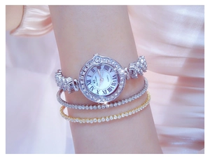 Elegant silver women's watch with rhinestones and Roman numerals on the dial