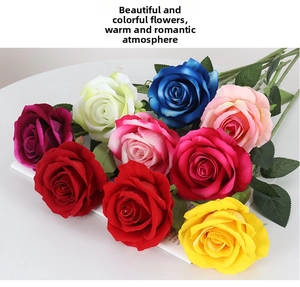 Close-up of multicolored velvet artificial roses including red and pink floral decorations
