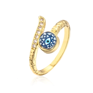 Macro shot of 18K gold plated evil eye ring with cubic zirconia and clear reflection