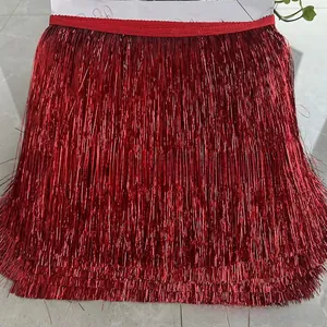 Macro detail of 20cm shiny red metallic fringe trim for festive garment decoration
